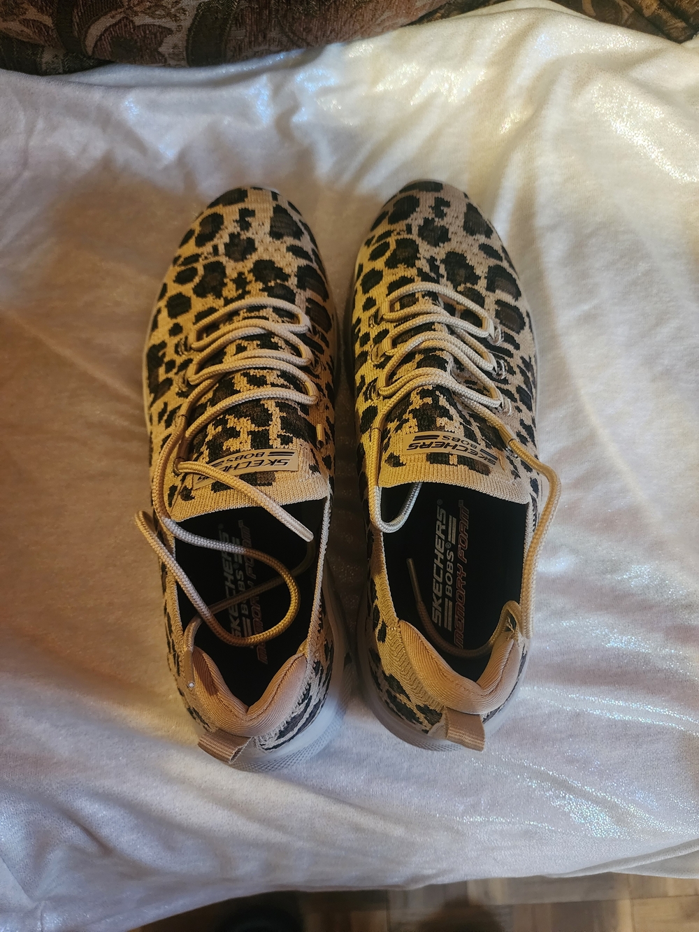Skechers Women's Leopard Print Slip-On Sneakers in Tan and Black